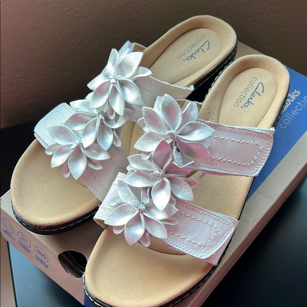 New in box Clarks White leather Sandals with Ruffled details.